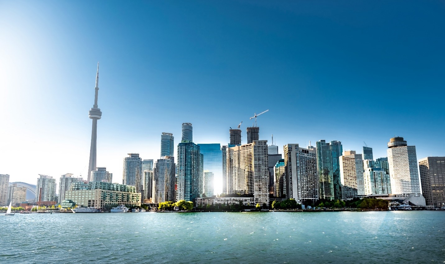 A view of the Toronto skyline, seen from the water.