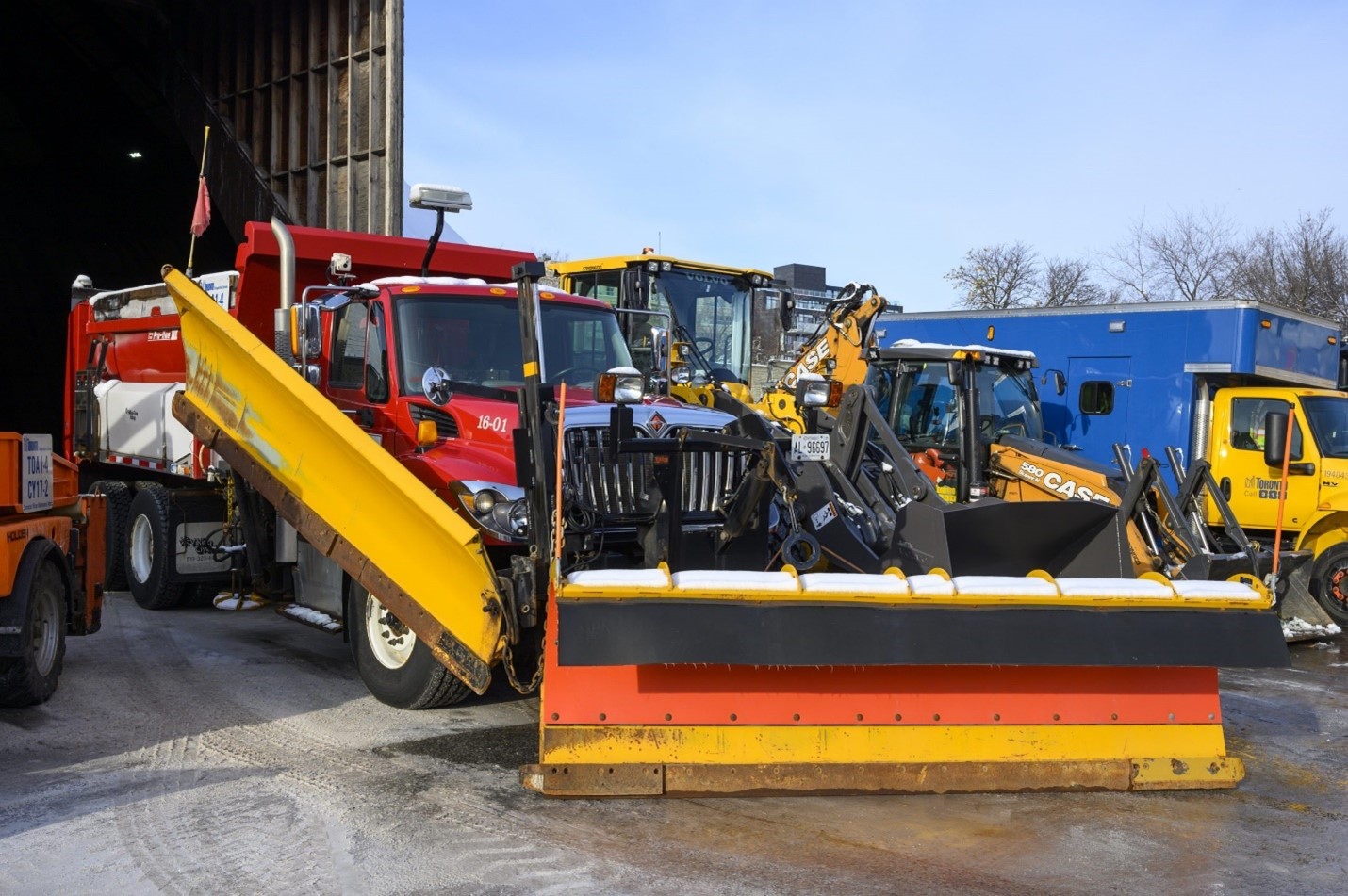 Image of snow plow ready for use in Toronto yard.